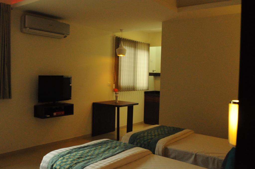 Ixora Suites Bangalore Zimmer foto
