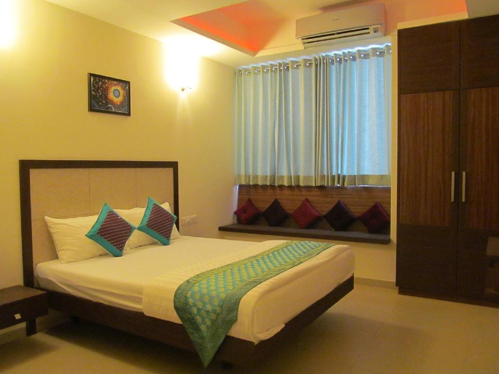 Ixora Suites Bangalore Zimmer foto